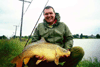 Rob with his medium sized carp, and pretty small rod.