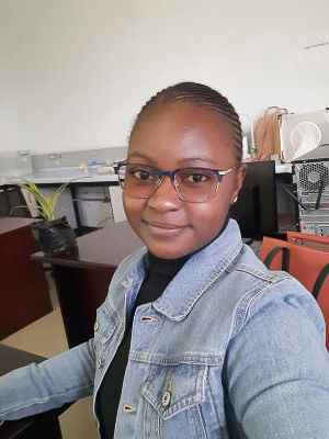 Vimbai is an African woman wearing glasses