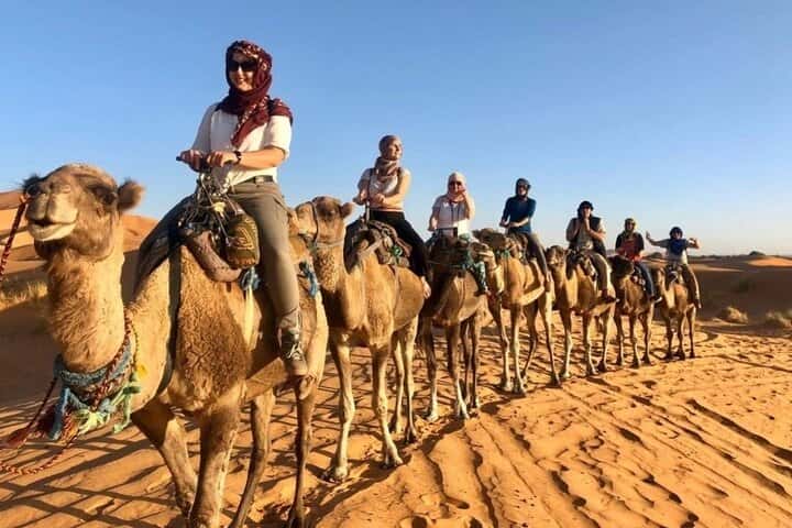 People riding Camels on the 3 day desert tour