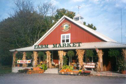 greatview orchards and farm market, view from highway, red barn building