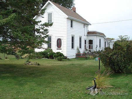 lake erie haven bed and breakfast, view of small white house from road