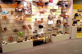 simply shoes, inside of store, shoes line the walls